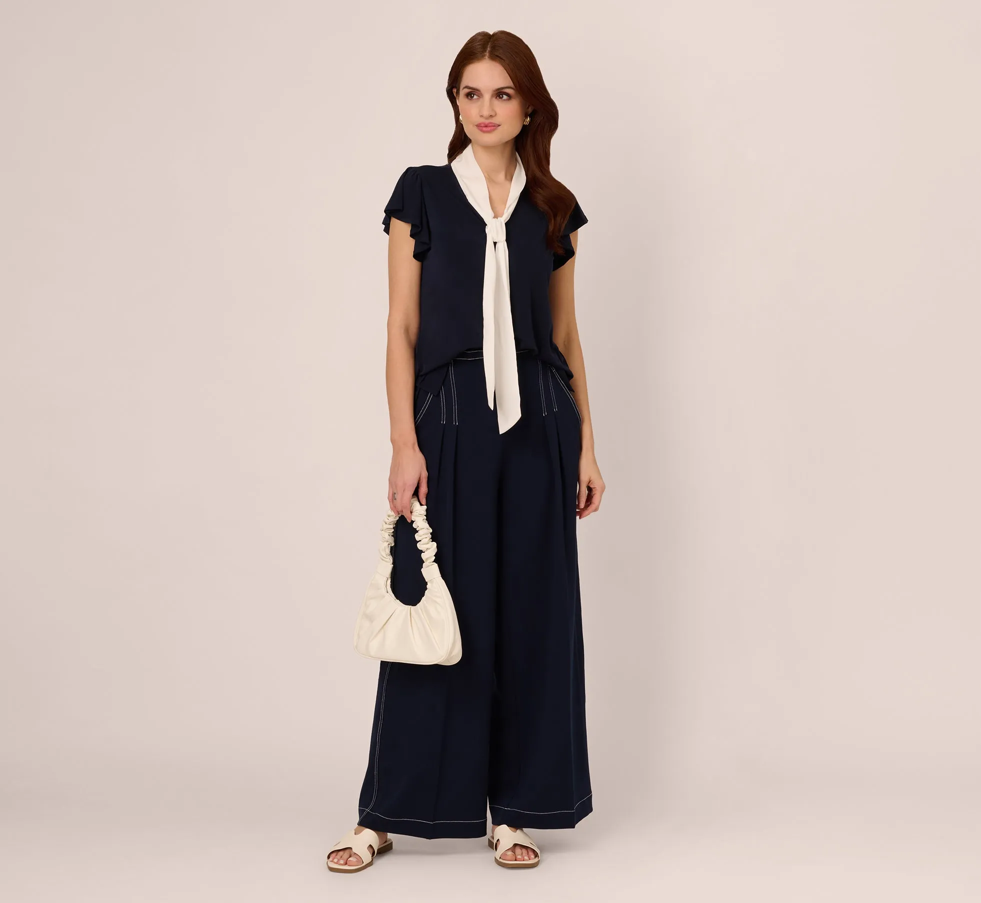 Flutter Sleeve Tie Neck Knit Top In Navy Ivory